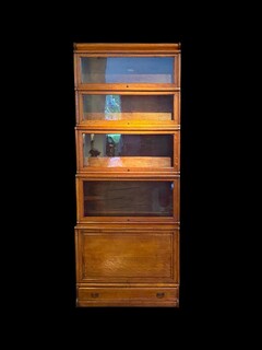 A 19th Century English Waterfall Globe Wernicke Oak Bookcase with Cupboard Base