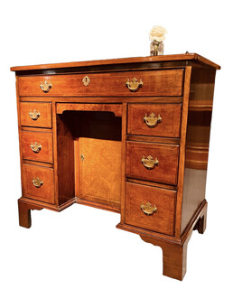 An English 19th Century Burr Walnut Kneehole Desk.