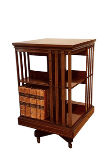 An English 19th Century Mahogany  Revolving Bookcase having an Cast Iron Base.