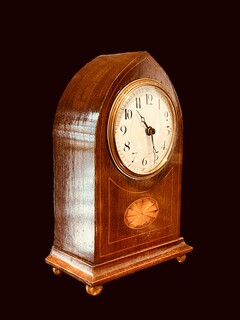 An English Edwardian Mahogany Mantel Clock having a Satinwood Inlay.