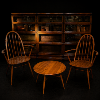 An English Mid-Century Ercol Set with Pair of Armchairs, Coffee Table and Globe Wernicke Bookcases